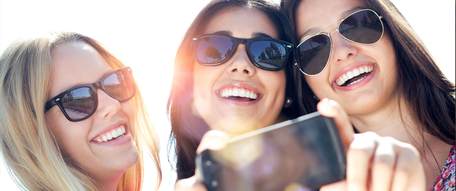 Friends smiling together after dental care